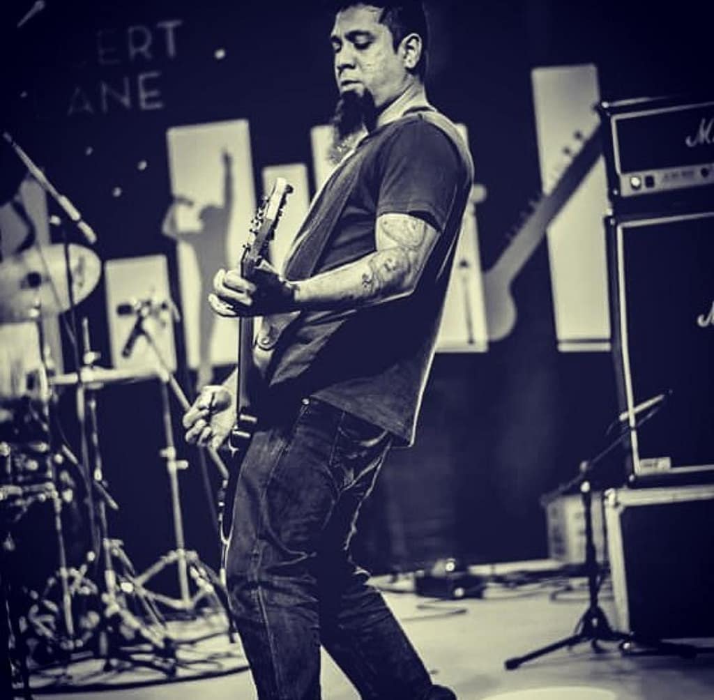 Eric Rodrigues performing Guitar on stage