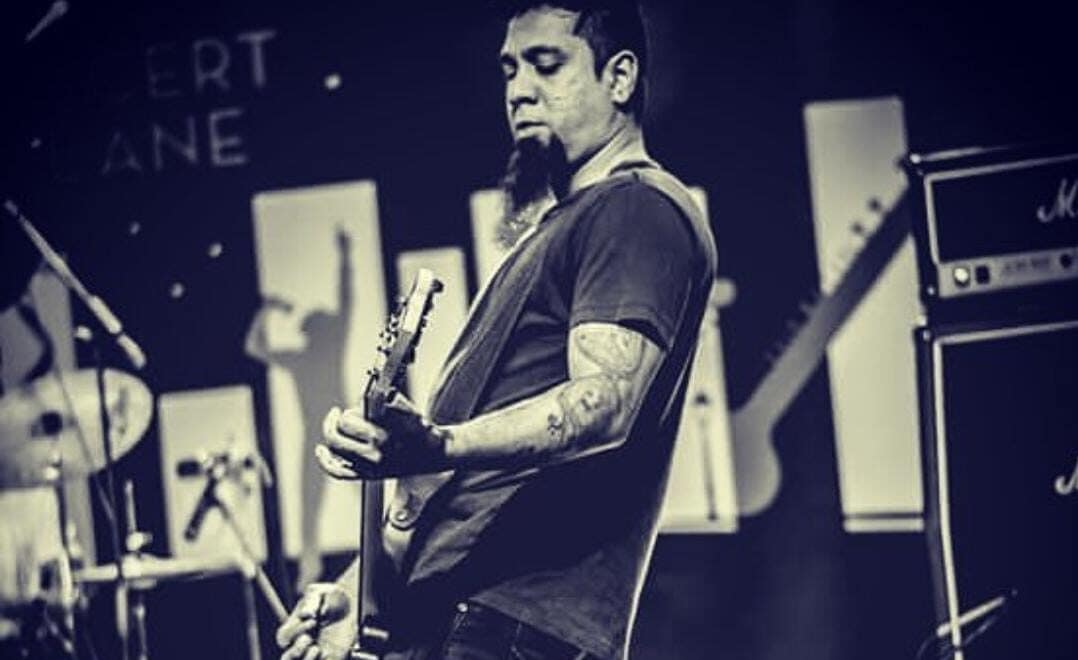 Eric Rodrigues performing Guitar on stage