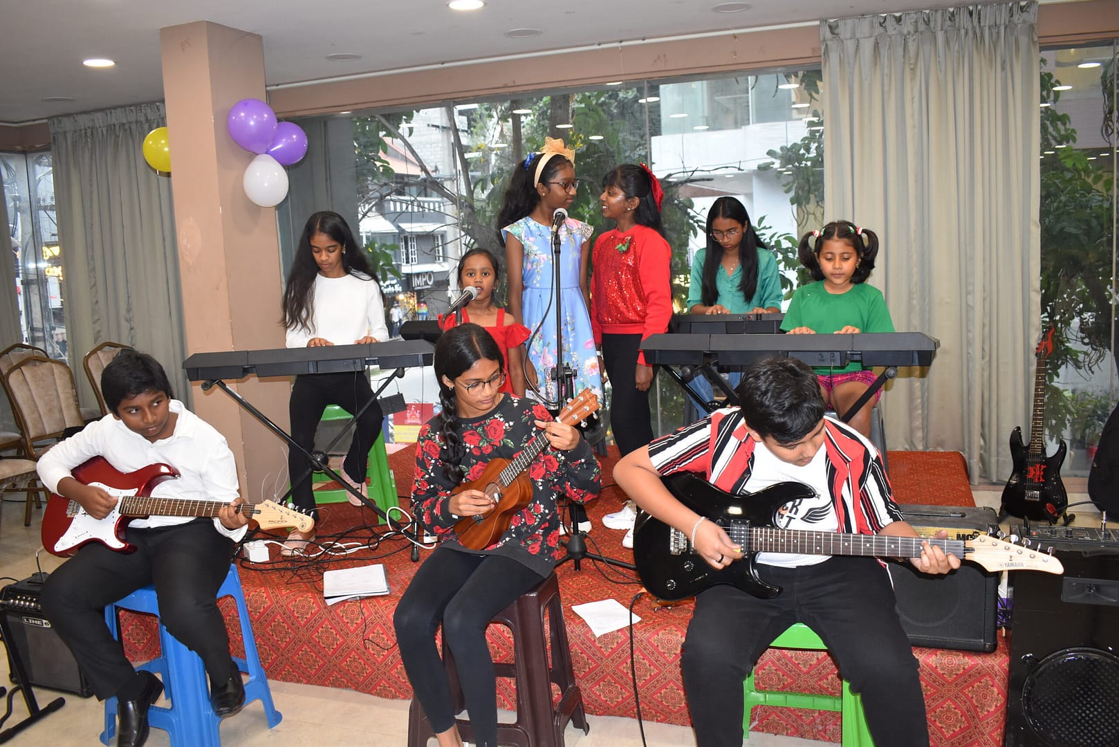 Student playing keyboard during The First Chord's Christmas Recital 2023 in Bangalore.