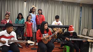 Students performing Ukulele Classes in Banaswadi during Christmas Recital