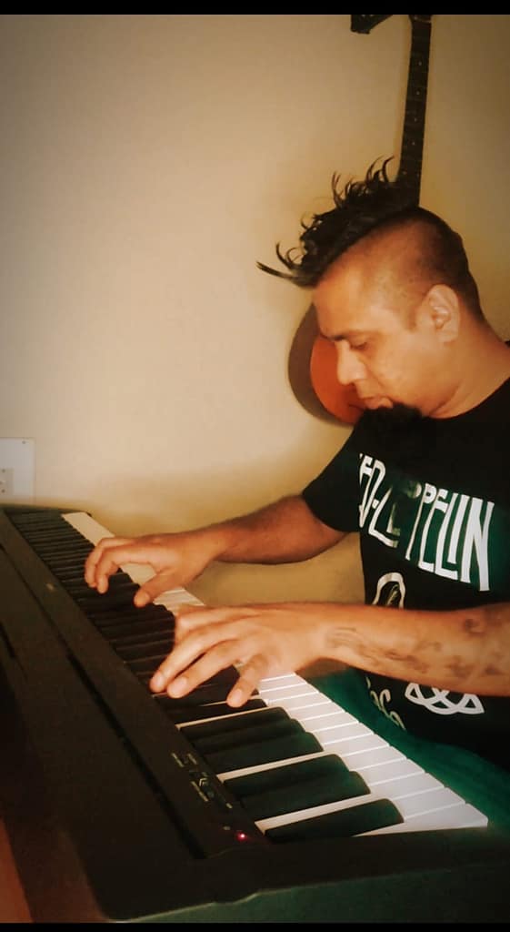 Eric Rodrigues playing the piano