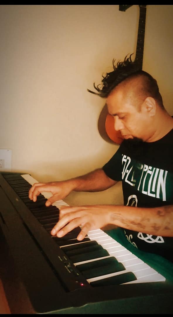 Eric Rodrigues playing the piano