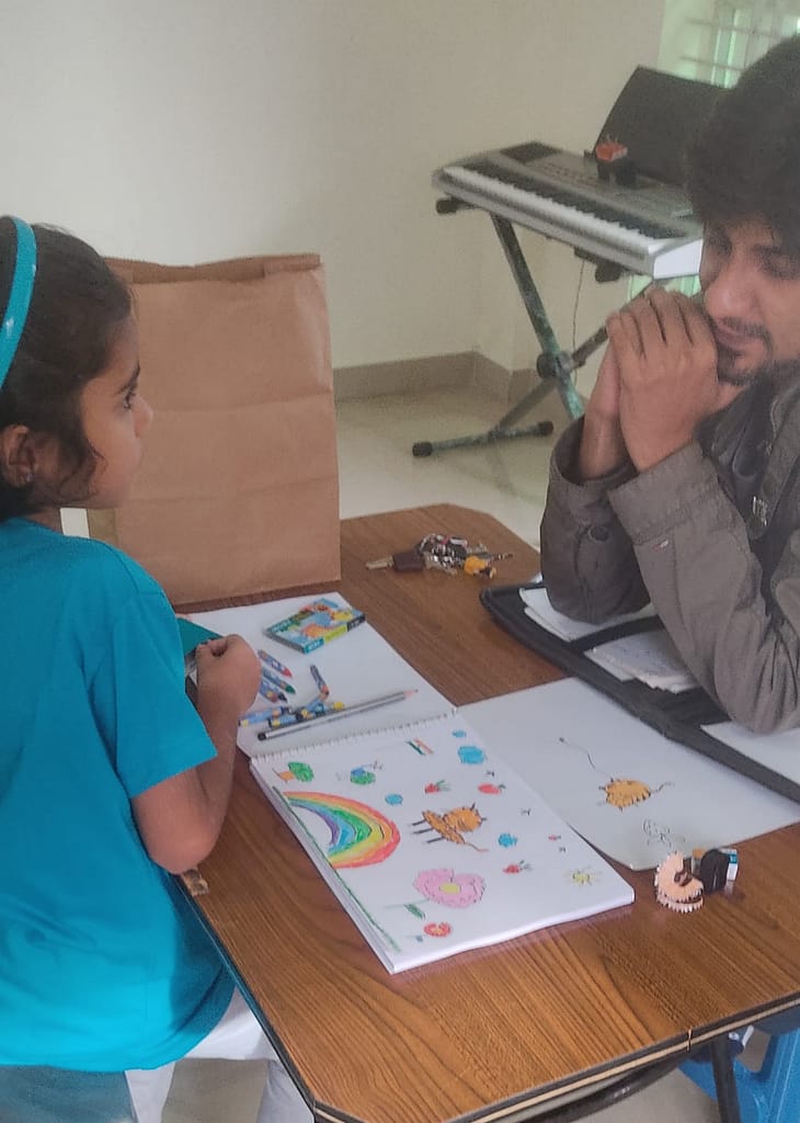 Teacher and Student During Art Class at The First Chord